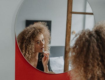 How Tongue Scraping Can Fight Off Acne, Bad Breath, and More